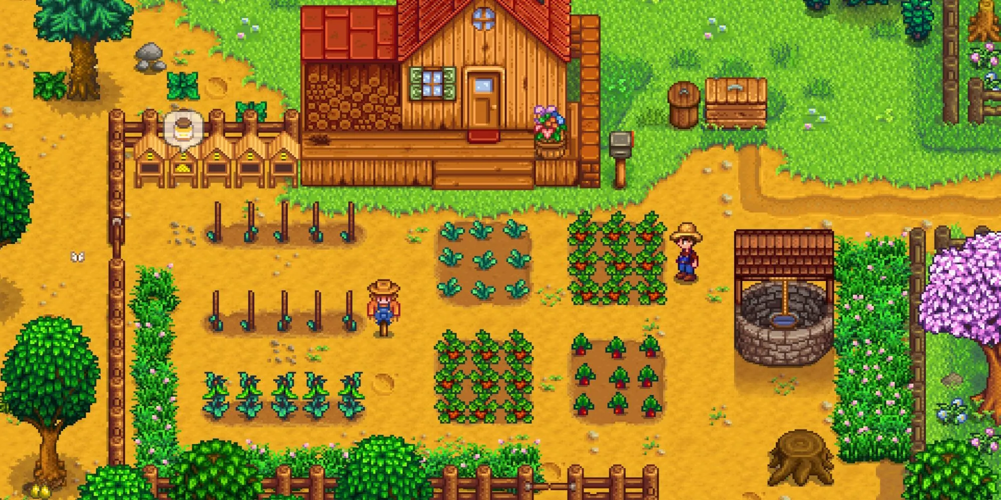 Nông trại của người chơi trong Stardew Valley với cây trồng, giếng nước, bù nhìn và tổ ong