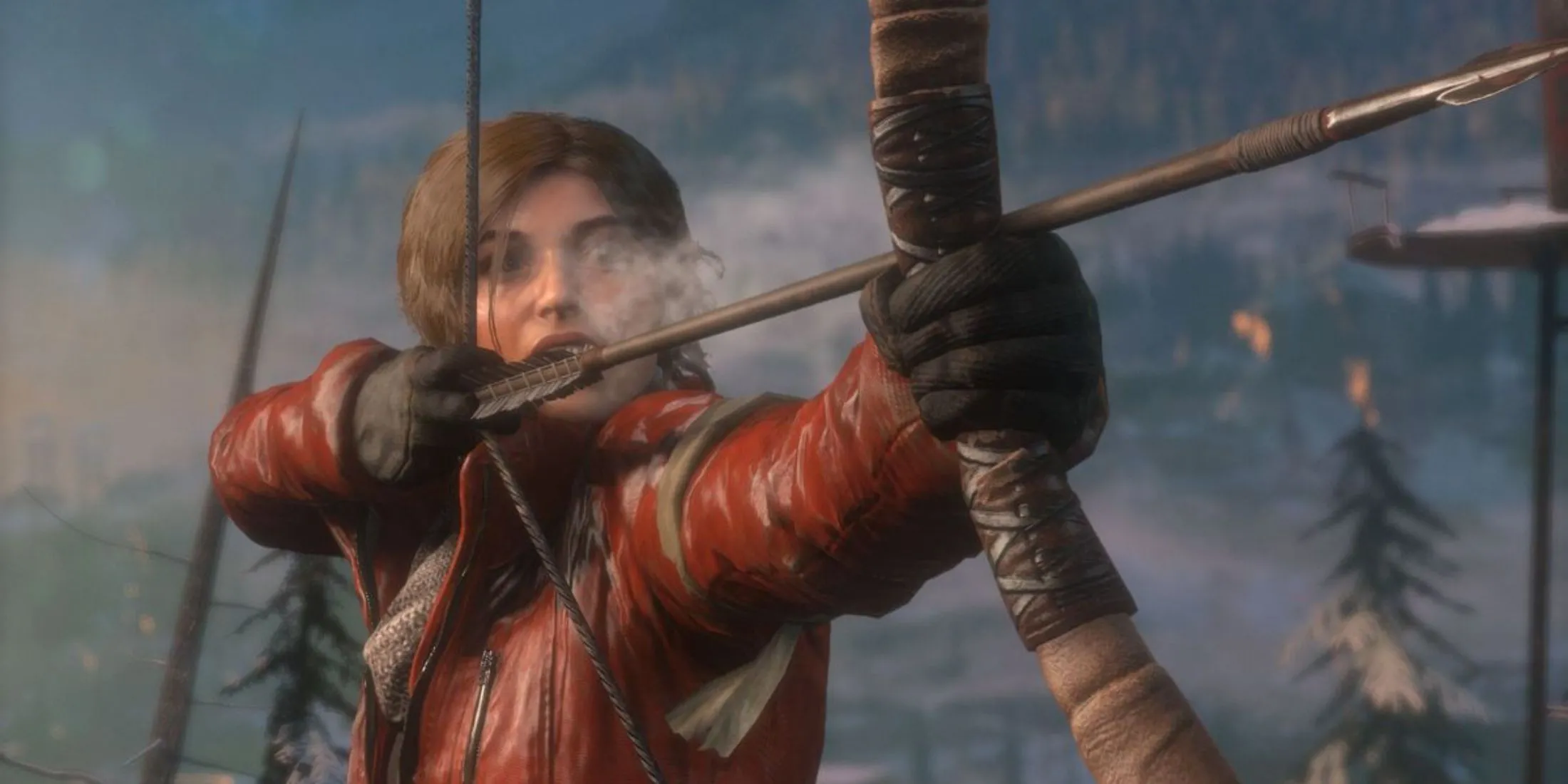 Lara Croft giương cung giữa khu rừng tuyết trắng trong Rise Of The Tomb Raider, sẵn sàng đối mặt thử thách