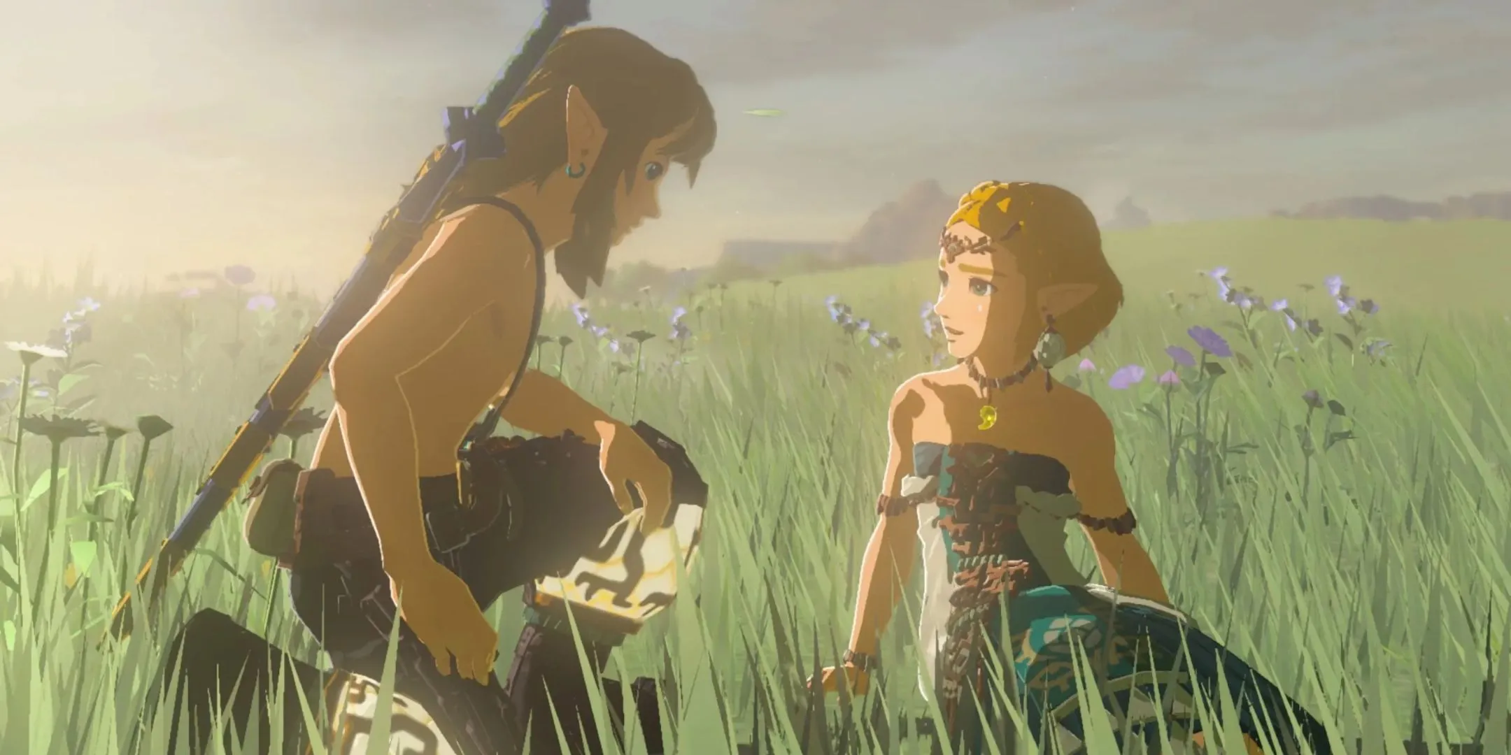 Link quỳ bên cạnh Công chúa Zelda giữa cánh đồng hoa trong game The Legend of Zelda Tears of the Kingdom